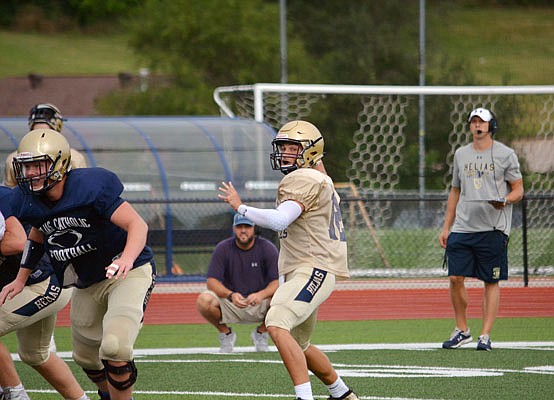 Helias quarterback Jacob Weaver drops back to throw during Saturday morning's scrimmage at the Crusader Athletic Complex.