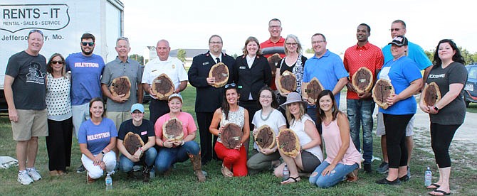 During Saturday's Redemption Inside the Walls concert, "Heroes of the Storm" were recognized at Jefferson City Jaycee's Fairgrounds. They were awarded wood planks from trees cut down after the May 22 tornado that hit Eldon and Jefferson City.