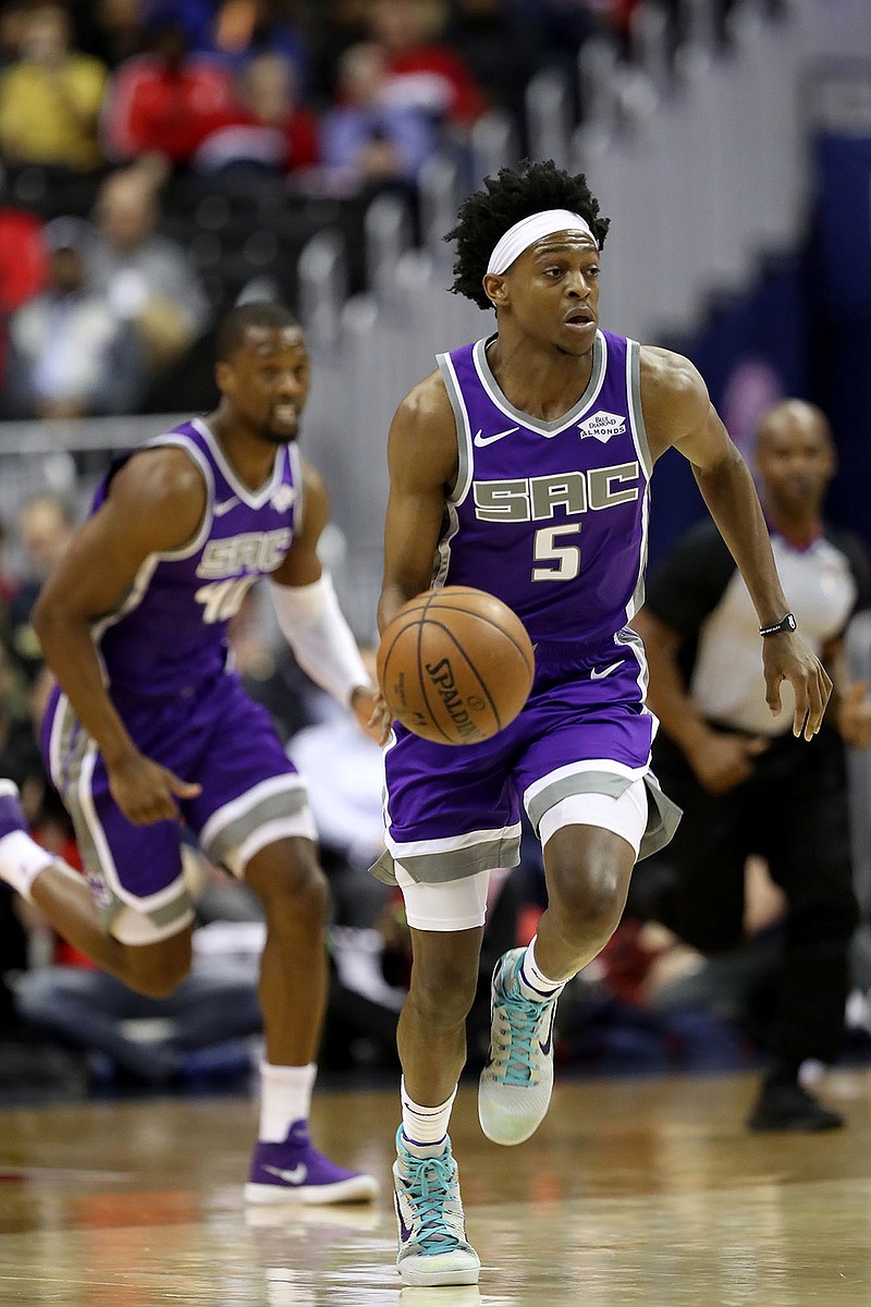 De'Aaron Fox (5) of the Sacramento Kings brings the ball up against the Washington Wizards at Capital One Arena in Washington, D.C., on March 11, 2019. (Rob Carr/Getty Images/TNS) 