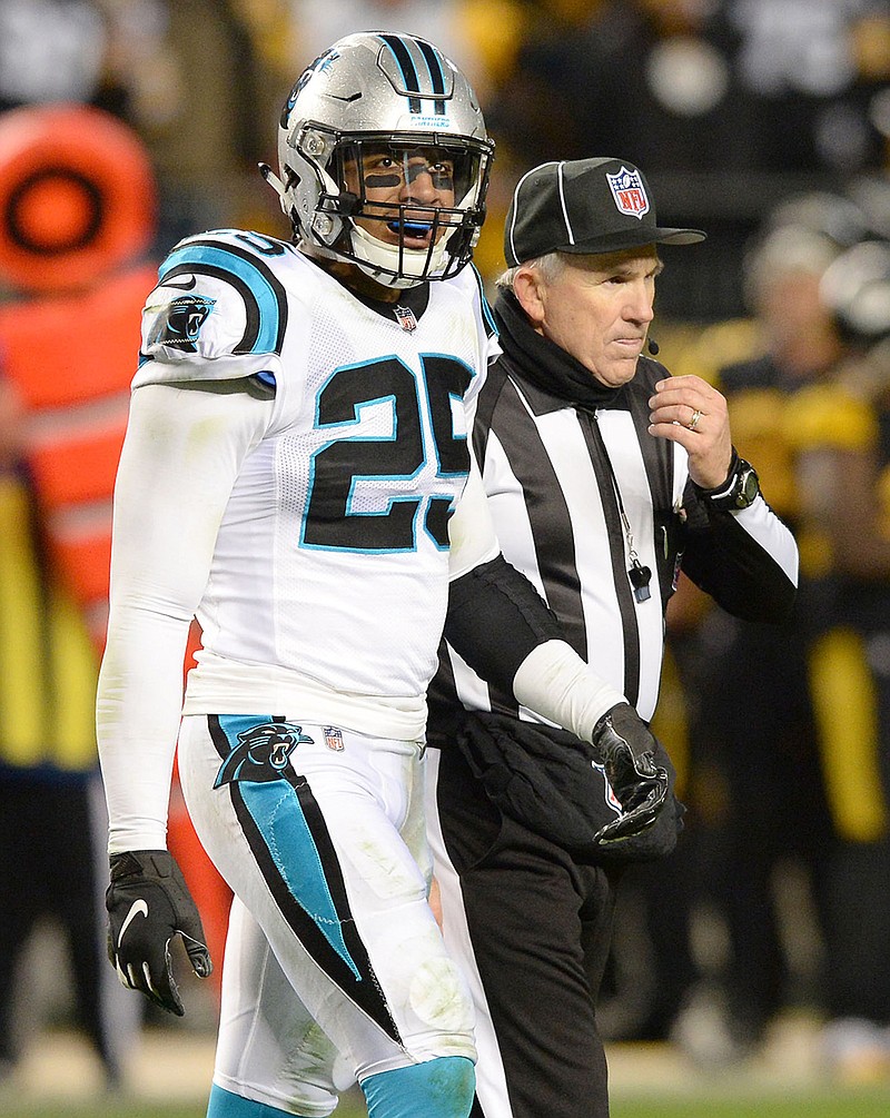 Carolina Panthers safety Eric Reid is led to the team's sideline by an official after he made a hit on Pittsburgh Steelers quarterback Ben Roethlisberger while he slid during third-quarter action at Heinz Field in Pittsburgh on Thursday, Nov. 8, 2018. The Steelers won, 52-21. (Jeff Siner/Charlotte Observer/TNS)