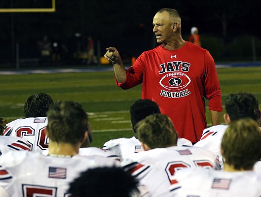 Jefferson City Jays football coach Terry Walker speaks to his team following a 34-13 win against St. Louis University High last season in St. Louis.