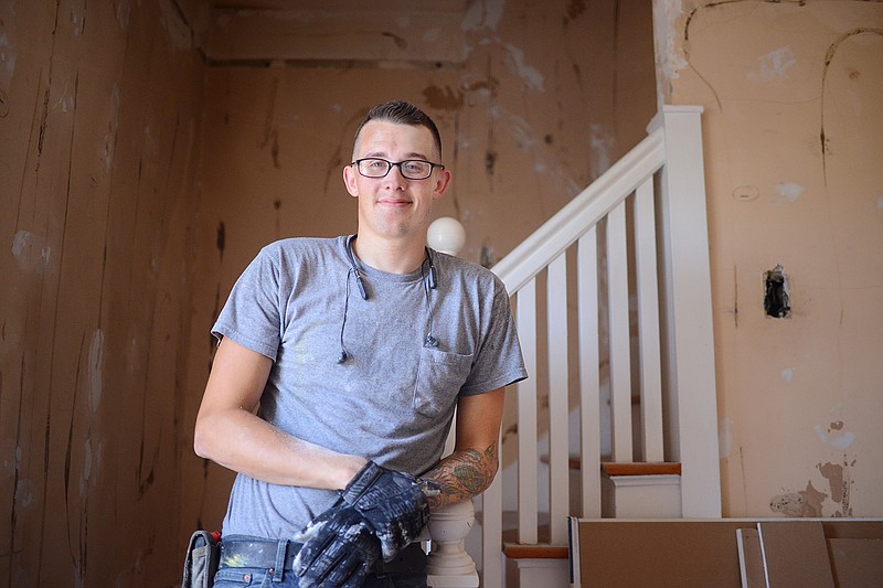 Joseph Jisa stands on a staircase Aug. 6 inside the Caretaker's Cottage at Jefferson City National Cemetery. Jisa is currently a student at the American College of Building Arts in Charleston, South Carolina. This summer, he worked with the Historic City of Jefferson to rehabilitate the cottage. 