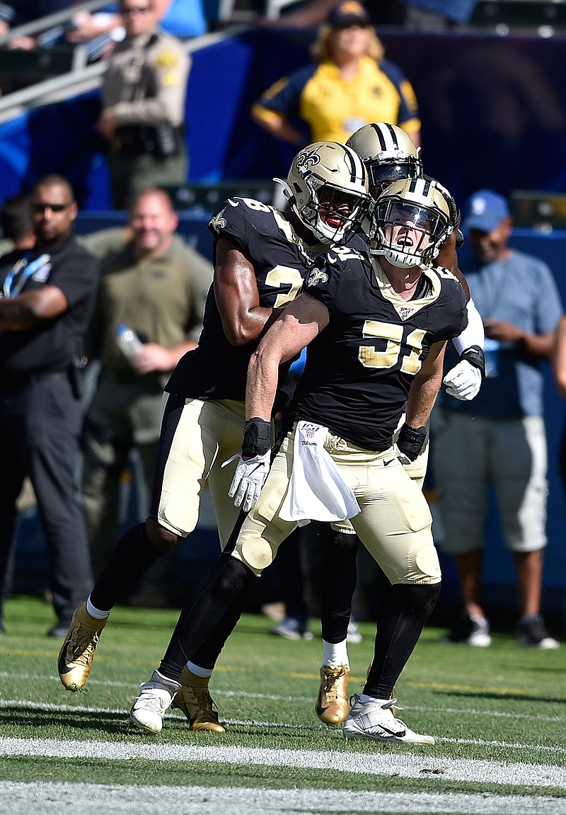 New Orleans Saints linebacker Colton Jumper celebrates with teammates after intercepting a pass during the fourth quarter of a preseason NFL football game against the Los Angeles Chargers Sunday, Aug. 18, 2019, in Carson, Calif. (AP Photo/Kelvin Kuo )