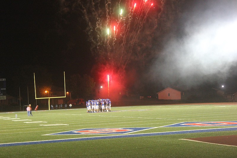 Fireworks go off as the California Pintos football team takes the field at the team's media night Aug. 16, 2019.