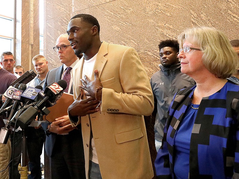 Former Wisconsin Badger football player Quintez Cephus speaks during a press conference Monday to reiterate his request for reinstatement to the university in Madison, Wis. The former wide receiver was acquitted earlier this month of sexual assault charges stemming from a campus incident in his apartment. He was expelled from the university in March after the university's own internal investigation. He is pictured with his attorneys, Stephen Meyer and Kathleen Stilling, as well as a group of current team members were on hand to show support for Cephus at the event. 