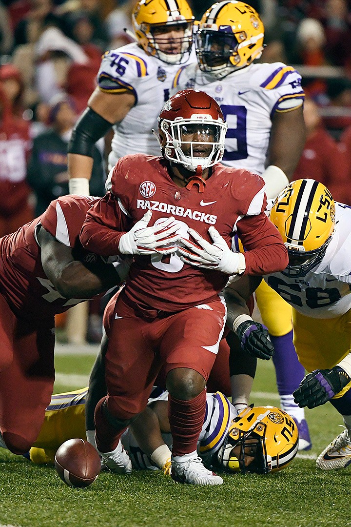  Arkansas defensive back De'Jon Harris celebrates after a tackle against LSU on Nov. 10, 2018, during the second half of a college football game in Fayetteville, Ark. The Razorbacks did not win an SEC game in coach Chad Morris' first season, but Harris was one of the best — and busiest — linebackers in the conference. Harris led the SEC in tackles with 118. 