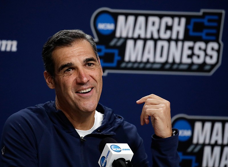  Villanova head coach Jay Wright speaks during a news conference March 22 at the men's college basketball NCAA Tournament in Hartford, Conn. Villanova students are headed back to school this week — while the Villanova men's basketball coach will be halfway around the world for the next month or so. It has been, and will continue being, a major schedule challenge for Wright as he's tasked with both helping USA Basketball win a gold medal while his college players are on campus getting ready to start their seasons.