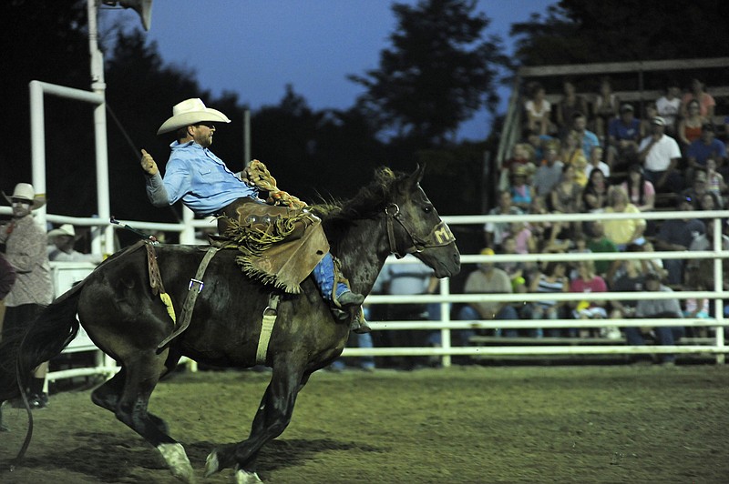 <p>News Tribune file photo</p><p><strong>Keith Brauer, of Freeburg, Ill., competes in a saddle bronc riding event at Cattlemen Days Rodeo in Ashland in 2014. The annual rodeo event returns to Ashland this weekend.</strong></p>