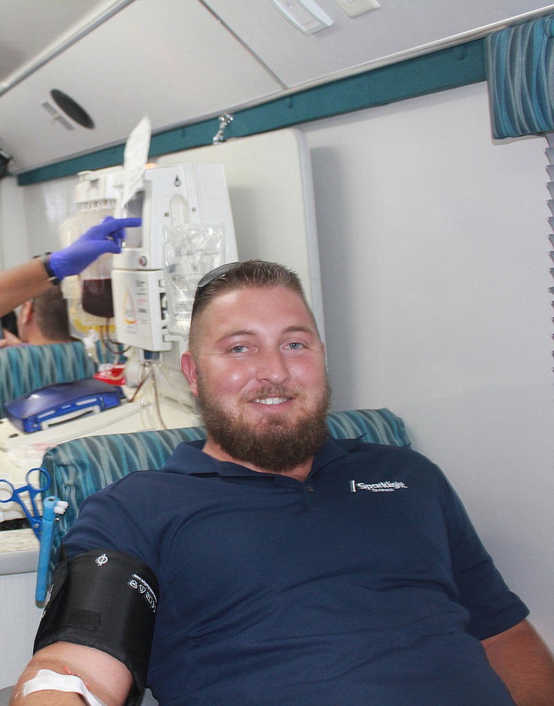 Cody Larose of Sparklight/Cable One steps up to help out during Tuesday's LifeShare blood drive at the Texarkana Chamber of Commerce. Larose, a Texarkana resident for just over two years, notes that it is easy to give blood here, as LifeShare can be seen everywhere taking donations.