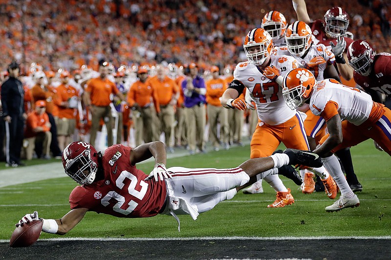 In this Jan. 7, 2019, file photo, Alabama's Najee Harris reaches for the end zone during the first half the NCAA college football playoff championship game against Clemson, in Santa Clara, Calif. Najee Harris has been a presence in Alabama's backfield pretty much since he arrived as one of the nation's top recruits. Now, he's finally the lead runner. (AP Photo/David J. Phillip, File)