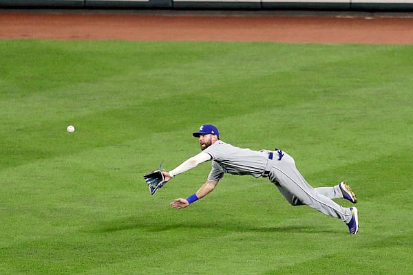 Royals right fielder Bubba Starling prepares to make a diving catch on a ball hit by Anthony Santander of the Orioles during the sixth inning of Tuesday night's game in Baltimore.
