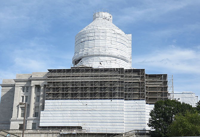 Now that much of the work on the east side of the Capitol is complete, scaffolding has been put up on the west side of the building, which is being wrapped to continue the project started more than a year ago to renovate, repair and rejuvenate the historic structure.