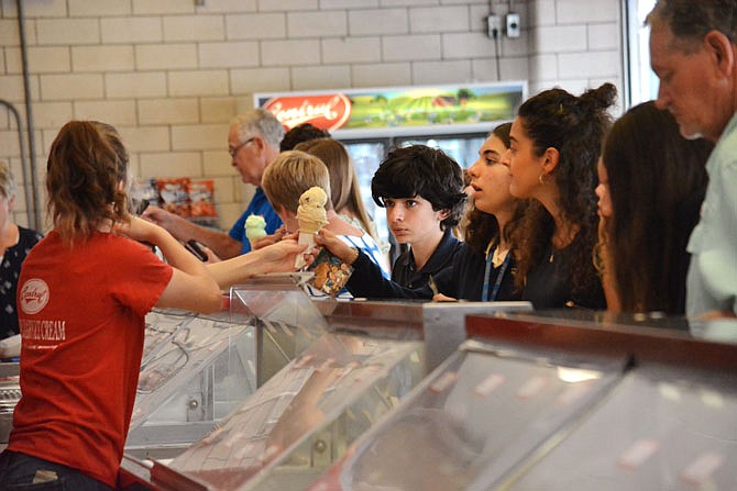 Students currently enrolled in the Whitney English Academy order helpings of ice cream Wednesday at Central Dairy. The students are on a two-week visit to the U.S. from Navalmoral de la Mata, Spain. In between taking classes at Helias High School, the group has been visiting tourist destinations around the Capital City. 