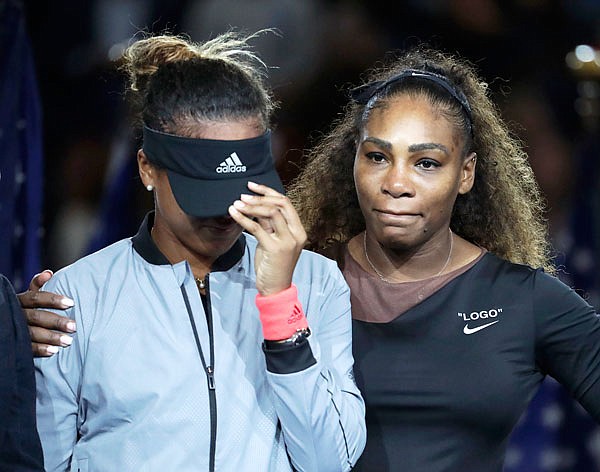 In this Sept. 8, 2018, file photo, Naomi Osaka (left) is hugged by Serena Williams after Osaka defeated Williams in the women's final of the U.S. Open in New York.