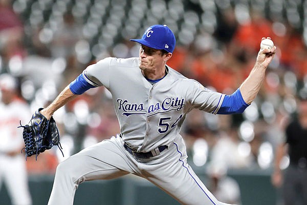 Royals relief pitcher Tim Hill throws a pitch to an Orioles batter during the sixth inning of Wednesday night's game in Baltimore. The Orioles won 8-1.