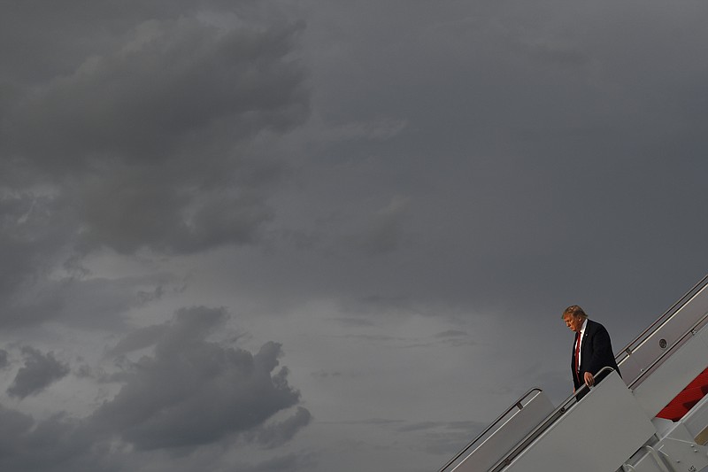 President Donald Trump walks down the steps of Air Force One at Andrews Air Force Base in Md., Wednesday, Aug. 21, 2019. Trump is returning from Louisville, Ky., where he spoke to the American Veterans (AMVETS) 75th National Convention. (AP Photo/Susan Walsh)