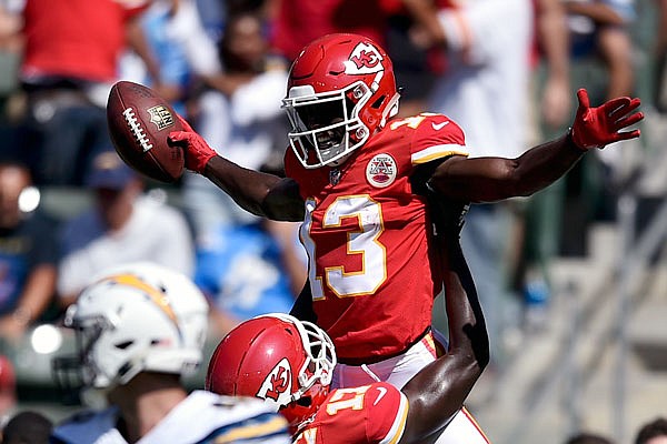 Chiefs wide receiver De'Anthony Thomas celebrates with teammate Chris Conley after scoring a touchdown during last season's game against the Chargers in Carson, Calif.