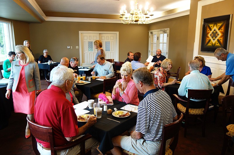 Fulton Colleges Scholarship Fund Drive participants brainstorm over breakfast Thursday. Over the next week, they'll work to raise money to fund scholarships for local high school students to attend Fulton's colleges.