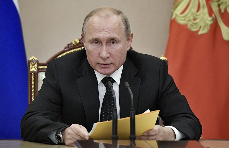 Russian President Vladimir Putin speaks at a meeting with members of the Security Council in the Kremlin in Moscow, Russia, Friday, Aug. 23, 2019. Putin ordered the Russian military to ponder a quid pro quo response after Sunday's test of a new U.S. missile banned under a now-defunct arms treaty. (Alexei Nikolsky, Sputnik, Kremlin Pool Photo via AP)