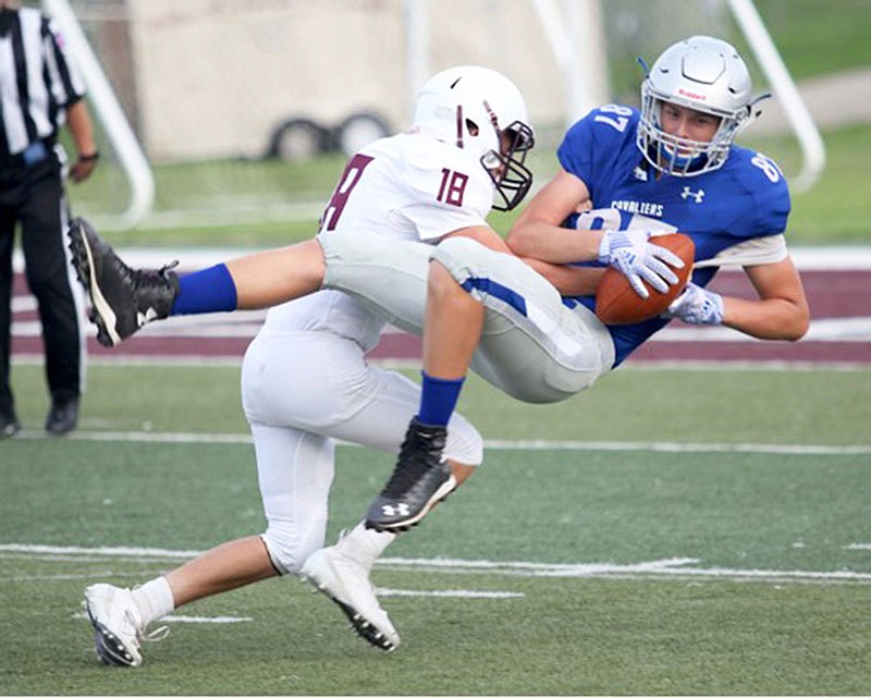 Capital City sophomore Grayson Jones hauls in a pass against Rolla during Friday night's Jamboree in Rolla.