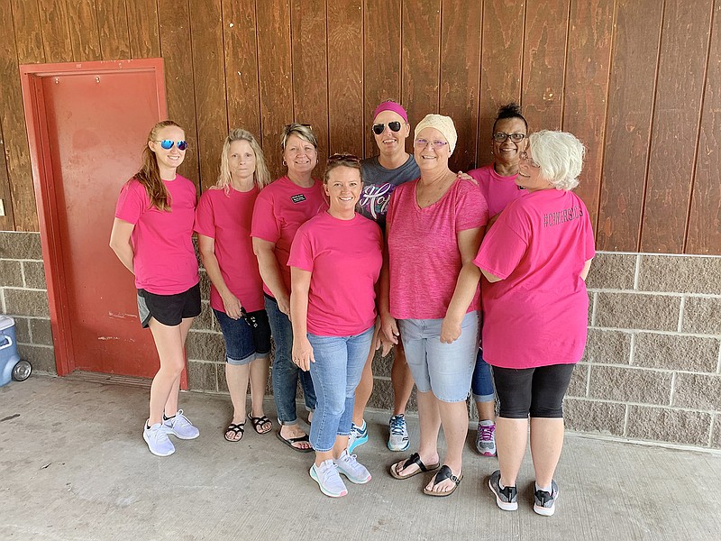 Sheila Richards and her coworkers, who put the fundraiser together for her, stand together under the pavilion at Memorial Park on Friday afternoon. Pictured, from left, are Tricia Hook, Lisa Ballard, Sharon Blakely, Ashley Wohlers, Clara Cannell, Sheila Richards, Jean Oliver and Meredith Clark.