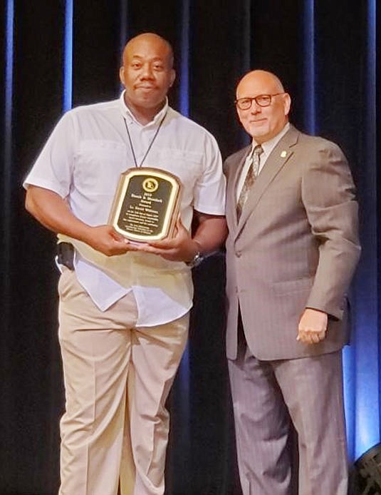 Jefferson City Police Department's Lt. David Williams, left, received the Enoch B. Morelock Award for the Western District of Missouri for his service to law enforcement.