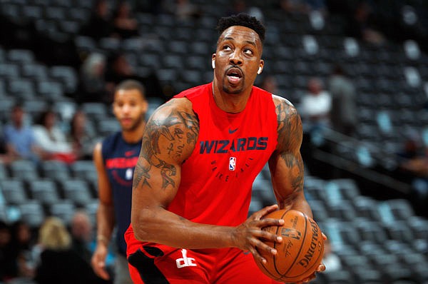 In this March 31 file photo, injured Wizards center Dwight Howard practices before a game against the Nuggets in Denver.