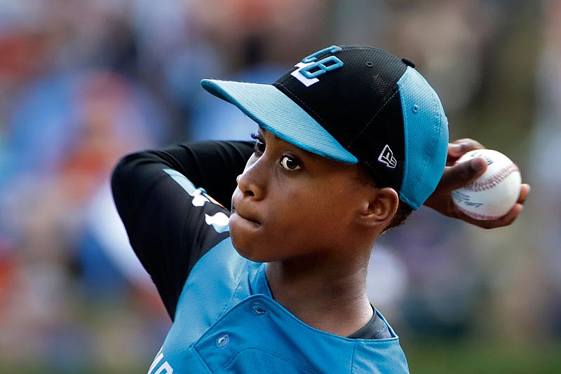 Curacao's Shendrion Martinus delivers a pitch in the second inning of the International championship game against Japan on Saturday at the Little League World Series in South Williamsport, Pa.