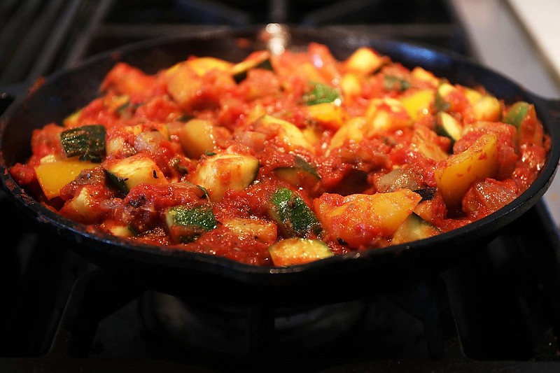 Ratatouille typically consists of roughly equal amounts of eggplant, zucchini and bell pepper, flavored with onion, garlic and herbs. Tomato is added in direct proportion to the cook's tastes. (Terrence Antonio James/Chicago Tribune/TNS) 