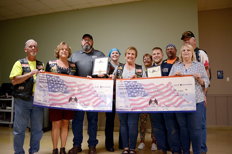 Sally Ince/ News Tribune
Members of the local American Legion award two military veterans with the Fallen Riders Scholarships Thursday September 5, 2019 at American Legion Post 5. James B. Hassell, center left, and Christopher S. Perry were awarded $1,000 each that will go toward their tuition at State Tech. 