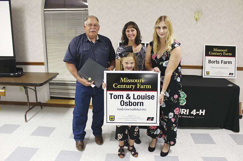 The Tom and Louise Osborn Family farm was recognized as a century farm Monday, Aug. 26, 2019, in Versailles, Mo. Those pictured are as follows: Tom Osborn, Louise Osborn, Charm Osborn and Aubrey Osborn.