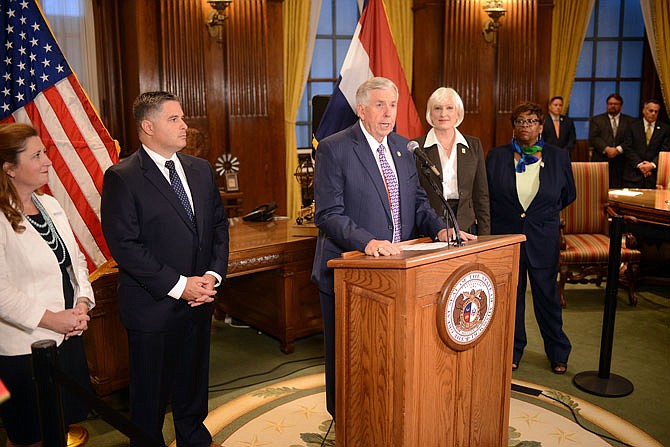 Gov. Mike Parson announces the official restructuring of four state agencies Wednesday during a press conference inside his office at the Capitol. The governor initially announced his administration would be restructuring some state departments in January.