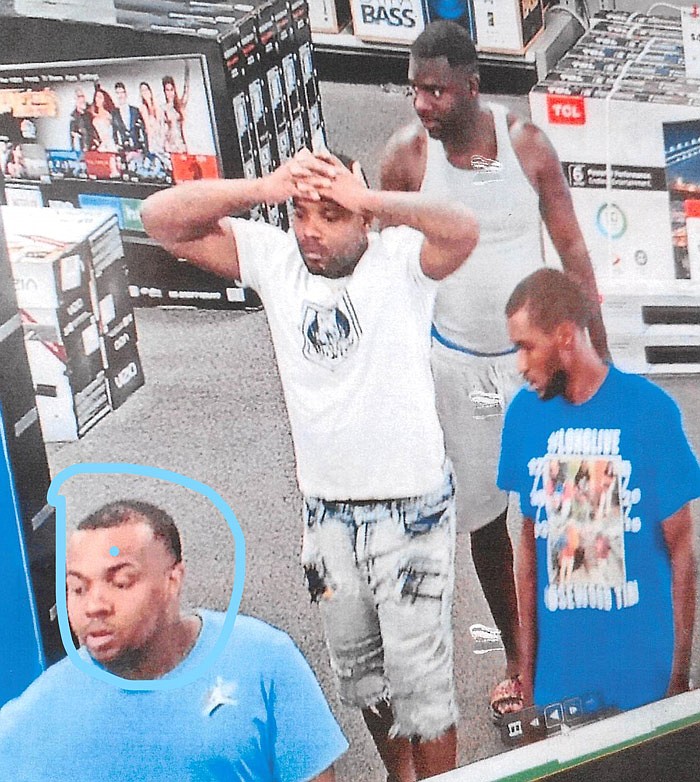 Jefferson City police provided this photo Thursday morning, Aug. 29, 2019, from security cameras at Best Buy, 3225 Missouri Blvd. The man circled by police in the photo was later taken into custody. The remaining three men in the photo are still being sought, and there is no photo available for an additional suspect who also is at large.