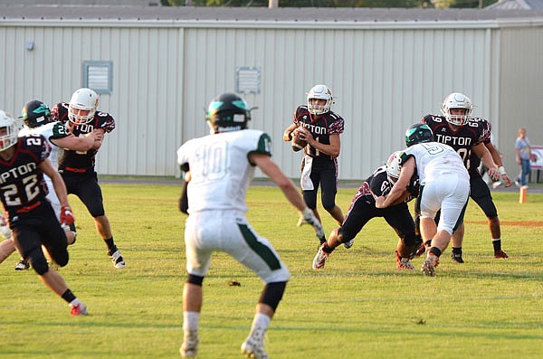 Blake Fischer (center) returns to start at quarterback for Tipton as the Cardinals are set to face St. Paul Lutheran: Conrcordia tonight to start the season.