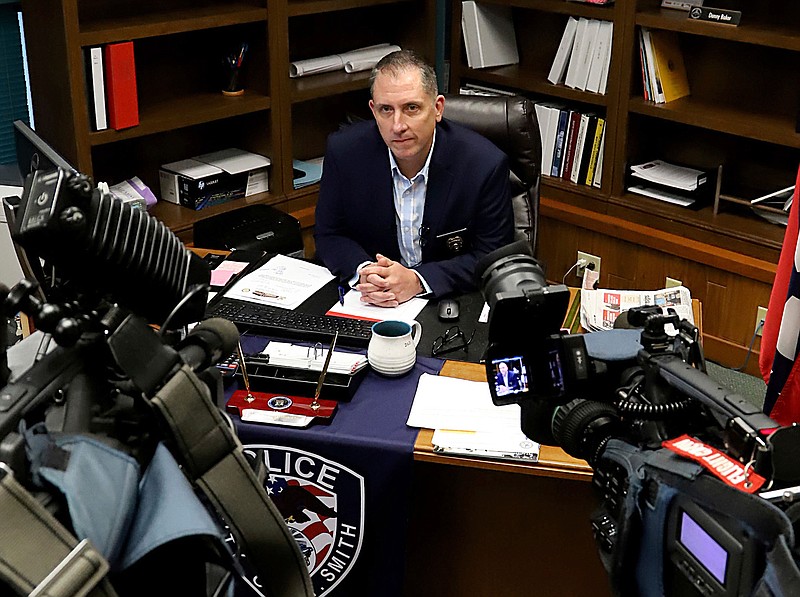In this Thursday, Aug. 29, 2019, photo, acting Fort Smith, Ark., Police Chief Danny Baker answers questions during a news conference at the police department in Fort Smith. Authorities are investigating after a now-former 911 dispatcher scolded a frantic newspaper delivery woman for driving into floodwaters; the woman later drowned. Baker said Thursday that Donna Reneau was working her final shift Aug. 24, when Debra Stevens died. (Jamie Mitchell/The Southwest Times Record via AP)