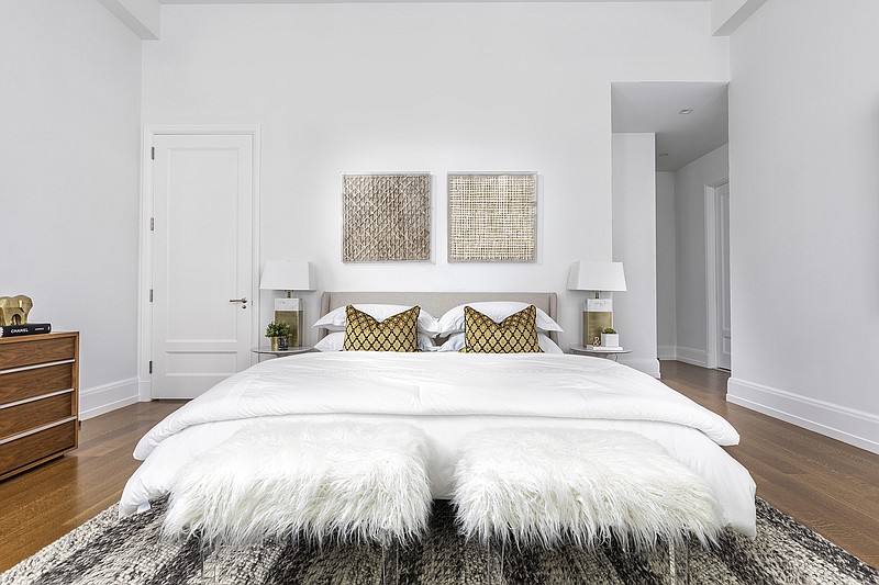 Two faux fur stools add texture to this bedroom. (Design Recipes/TNS)