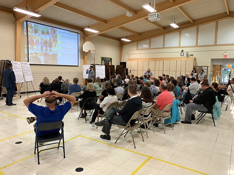 Hollis + Miller architects Grant Thome and Justin Durham address the crowd of approximately 75 people at Fulton Public Schools' community forum Thursday evening at McIntire Elementary. Solutions were presented for the districts spacing issue at each of the elementary schools.