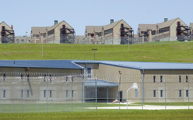 Maximum security housing units at the Jefferson City Correctional Center are seen below dormitory-style housing at the minimum security Algoa Correctional Center in this June 24, 2004, photo in Jefferson City, Mo. (AP Photo/Kelley McCall)