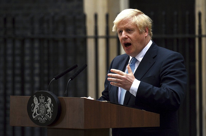 Britain's Prime Minister Boris Johnson speaks to the media outside 10 Downing Street in London, Monday, Sept. 2, 2019. Johnson says he doesn't want an election amid Brexit crisis and issued a rallying cry to lawmakers to back him in securing Brexit deal.(Kirsty O'Connor/PA via AP)