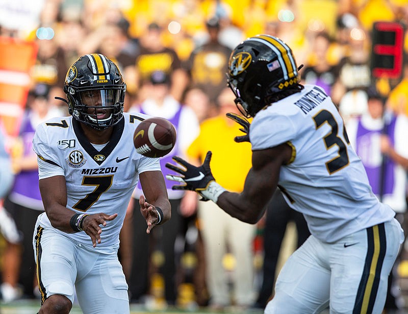 Kelly Bryant pitches the ball to Larry Rountree during the first quarter of last Saturday's game against Wyoming in Laramie, Wyo.
