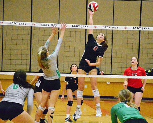 Annabelle Maassen of the Lady Jays goes up for a hit during a match last season at Fleming Fieldhouse.