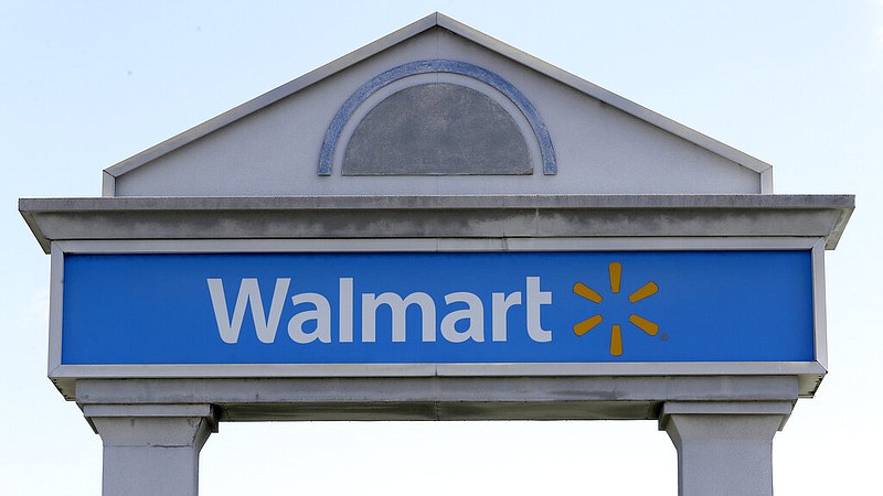A Walmart logo forms part of a sign outside a Walmart store, Tuesday, Sept. 3, 2019, in Walpole, Mass.