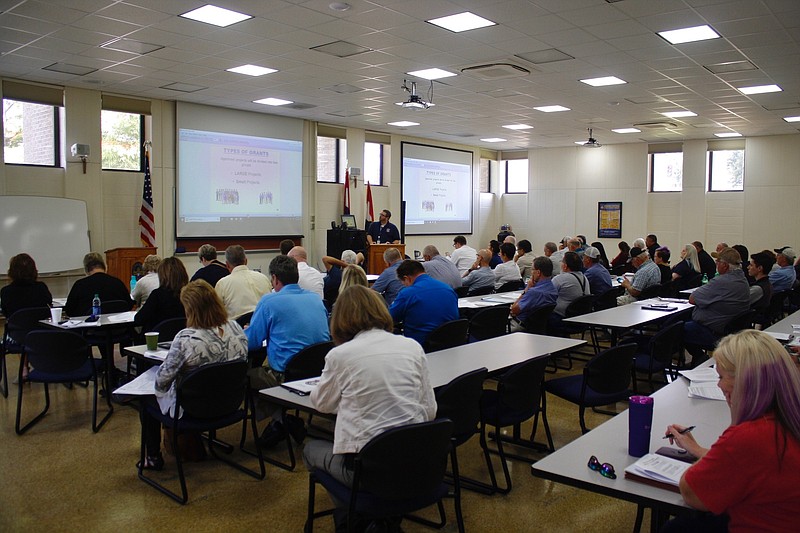 Matthew Boley presents to local officials Tuesday, Sept. 3, 2019, at an applicant briefing for FEMA public assistance at the Jefferson City Police Department.
