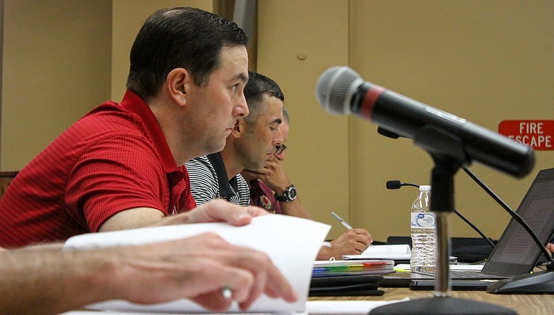 Texarkana, Texas, Fire Department union members discuss bargains with city negotiators to continue the discussion of new contracts on Wednesday in the City Hall council chambers in Texarkana.