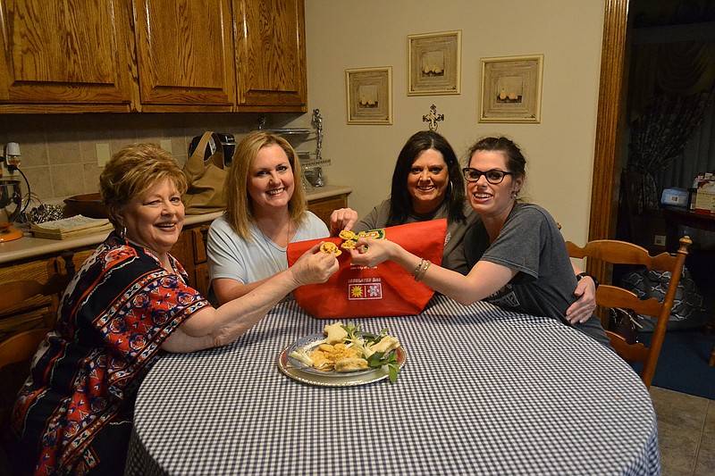 Joan Reece and Kay Lynn York, co-owners of To The Moon Family Foods, celebrate their contest win with Andra Reece Wisdom and Brooke Wisdom.  (Photo by Katie Stow)