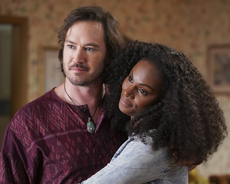 This image released by ABC shows Mark-Paul Gosselaar, left, and Tika Sumpter in a scene from "mixed-ish," premiering on Sept. 24 on ABC. (Eric McCandless/ABC via AP)