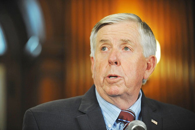 File: Missouri Gov. Mike Parson addresses the media May 29 during a news conference in his Capitol office in Jefferson City. Parson has pledged more resources and help from the Missouri Highway Patrol to counteract a rash of gun violence and child murders that have shaken St. Louis, but he remains noncommittal on whether cities should be able to enact their own gun control laws.