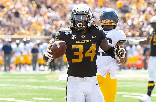 Missouri running back Larry Rountree III celebrates a first down during the first half of Saturday's game against West Virginia at Faurot Field.