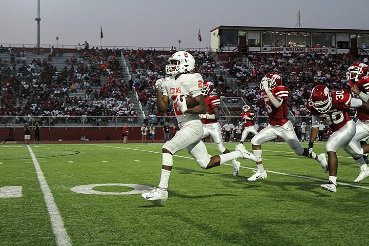 Texas Tigers running back Tracy Cooper runs towards the endzone to score a touchdown against the Razorbacks at Razorback Stadium on Friday, September 6, 2019, in Texarkana, Ark. Staff photo by Hunt Mercier