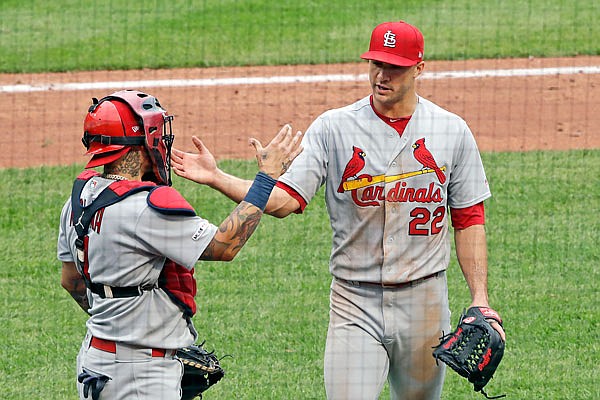 Cardinals starting pitcher Jack Flaherty is greeted by cacher Yadier Molina as he walks off the field after pitching the bottom of the eighth inning in Sunday afternoon's game against the Pirates in Pittsburgh.